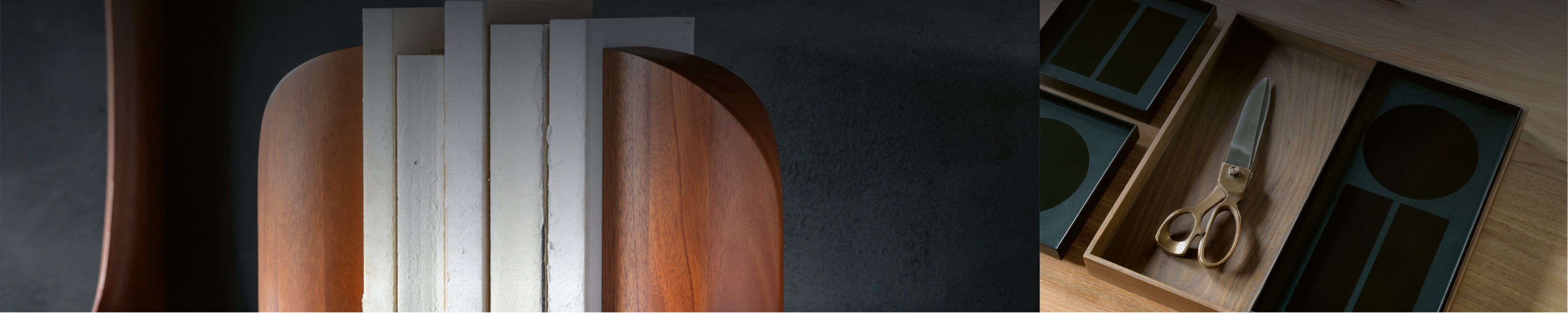 Detail eines hochwertigen Holzschreibtisches mit Schubladeneinsatz, Ordnungssystem mit Schere und Stiften