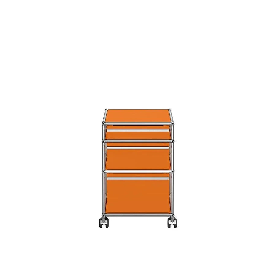 Designcontainer M63 in Reinorange von USM Haller – auffälliger Farbimpuls für kreative Workspaces und strukturierte Arbeitsbereiche mit Persönlichkeit